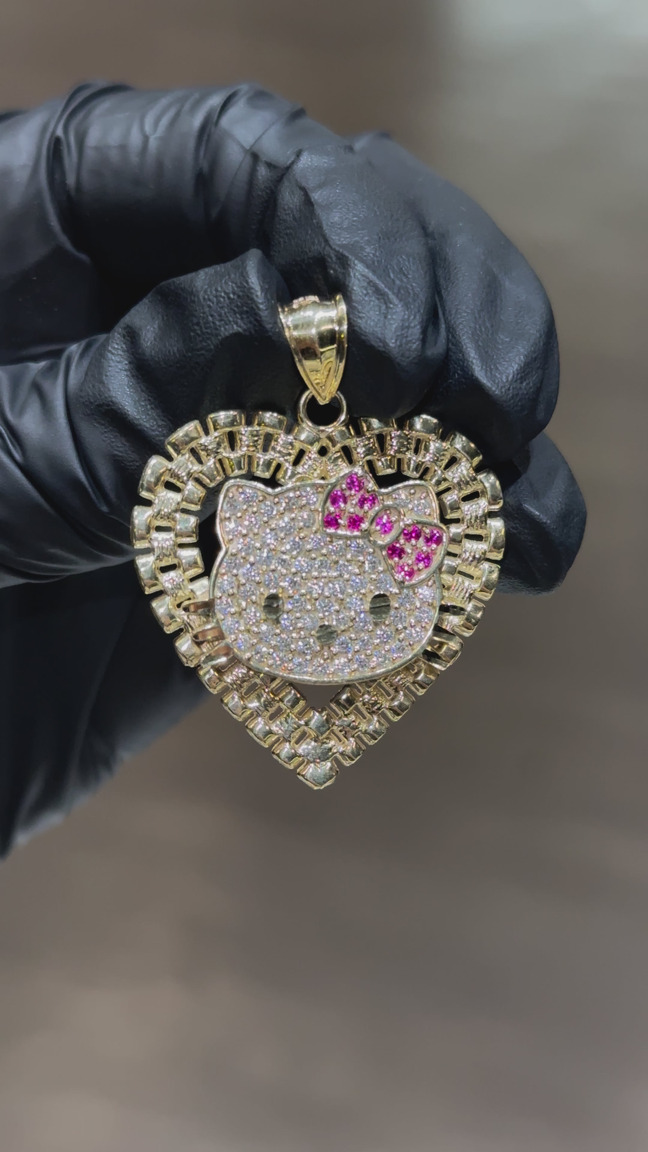Load video: 10k Large Crystal Rolex Hello Kitty Pendant