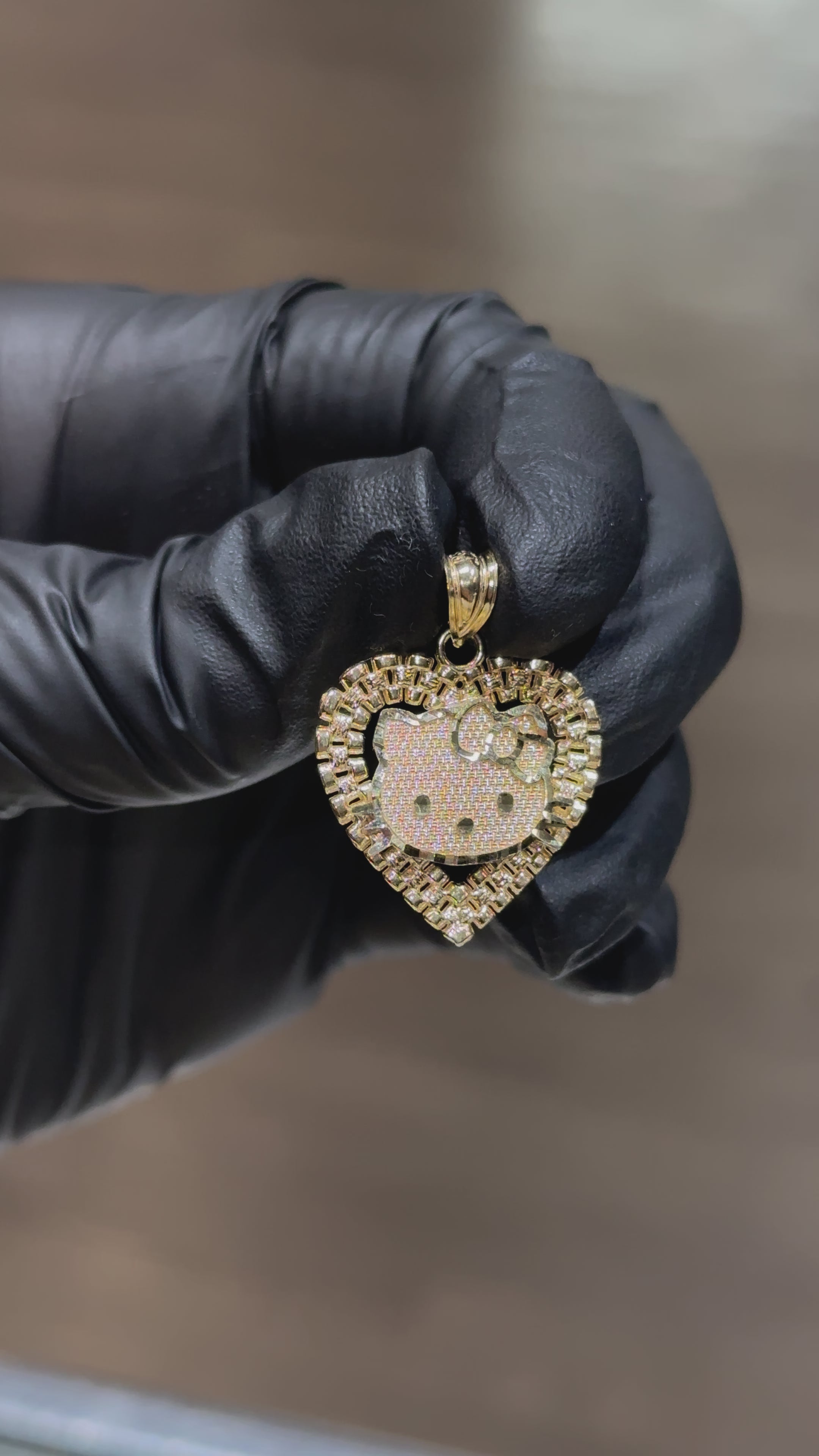 Load video: 10k Rolex Hello Kitty Pendant
